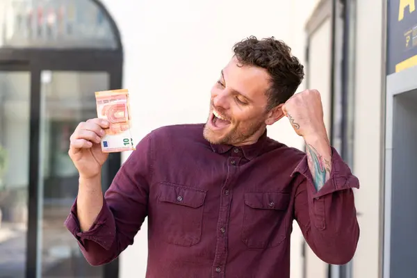 Young Caucasian Man Taking Lot Money Outdoors Celebrating Victory — Stock Photo, Image