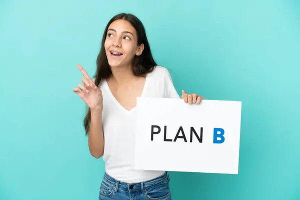 Young French Woman Isolated Blue Background Holding Placard Message Plan — Stock Photo, Image