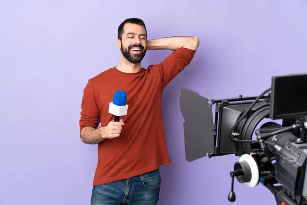 Reporter Man Holding Microphone Reporting News Isolated Purple Background Laughing — Stock Photo, Image