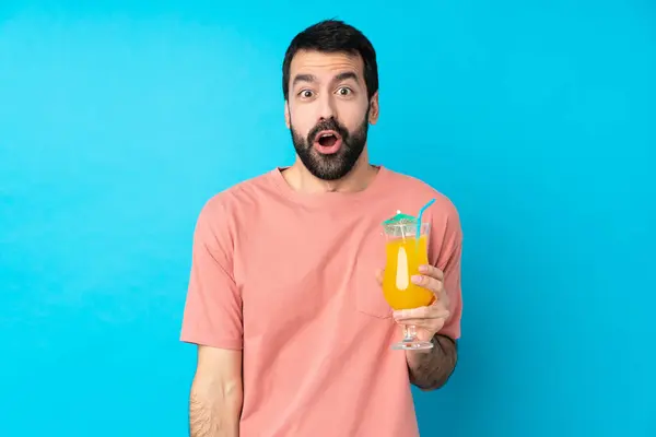 Young Man Holding Cocktail Isolated Blue Background Surprise Facial Expression — ストック写真