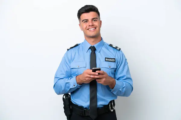 Young Police Caucasian Man Isolated White Background Sending Message Mobile —  Fotos de Stock