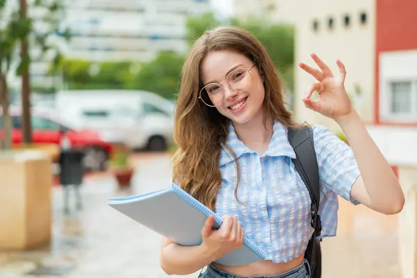 Young Redhead Student Woman Outdoors Showing Sign Fingers — Stock Photo, Image
