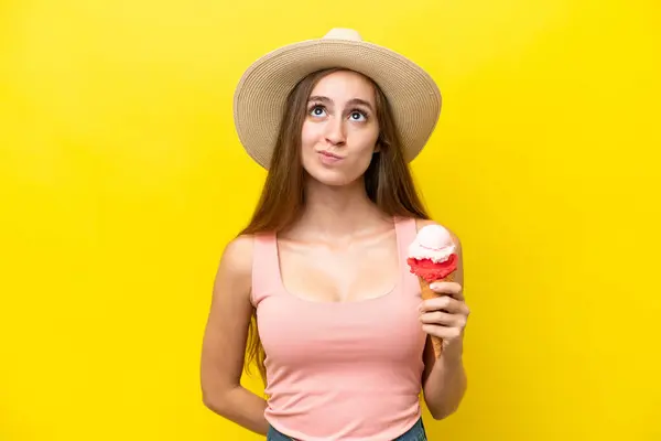 Young Caucasian Cornet Ice Cream Isolated Yellow Background Looking — Stock Photo, Image
