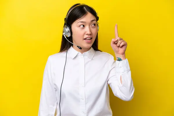 Telemarketer Chinese Woman Working Headset Isolated Yellow Background Intending Realizes — Stock Photo, Image