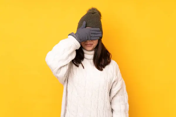 Young Woman Winter Hat Isolated Yellow Background Covering Eyes Hands — Stockfoto