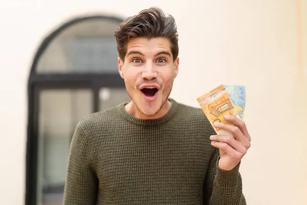 Young Caucasian Man Taking Lot Money Outdoors Surprise Shocked Facial — Stock Photo, Image
