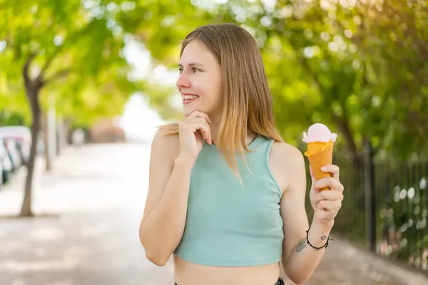 Young Blonde Pretty Woman Cornet Ice Cream Outdoors Thinking Idea — Stock Photo, Image