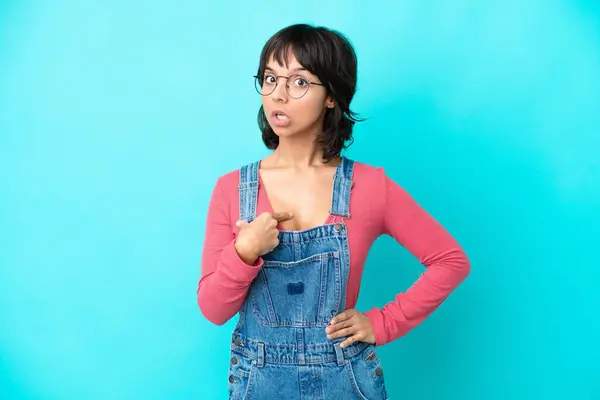 Young Woman Overalls Isolated Background Pointing Oneself Royalty Free Stock Images