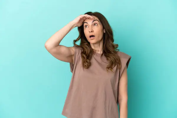 Middle Aged Caucasian Woman Isolated Blue Background Doing Surprise Gesture Стоковое Фото