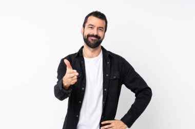 Young man with beard over isolated white background shaking hands for closing a good deal