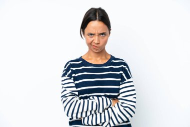Young hispanic woman isolated on white background with unhappy expression