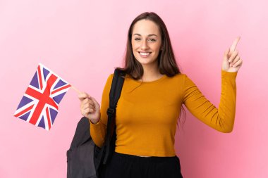 Birleşik Krallık bayrağını tutan genç İspanyol kadın en iyinin işareti olarak parmağını kaldırıyor ve gösteriyor.