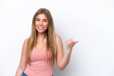 Young caucasian woman isolated on white bakcground pointing to the side to present a product