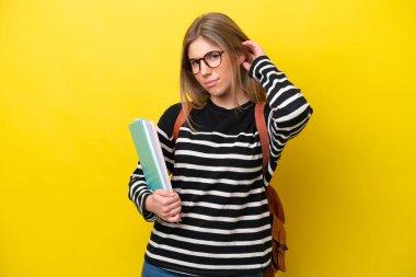Young student woman isolated on yellow background background having doubts