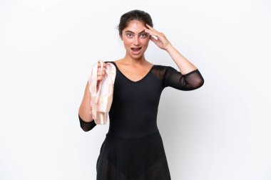 Young caucasian woman practicing ballet isolated on white background with surprise expression