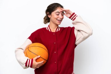 Young basketball player woman isolated on white background smiling a lot