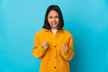 Young latin woman isolated on blue background frustrated by a bad situation clipart