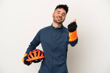 Young cyclist man isolated on white background making money gesture clipart