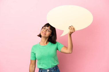 Youing woman holding an empty speech bubble