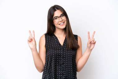 Young Brazilian woman isolated on white background showing victory sign with both hands