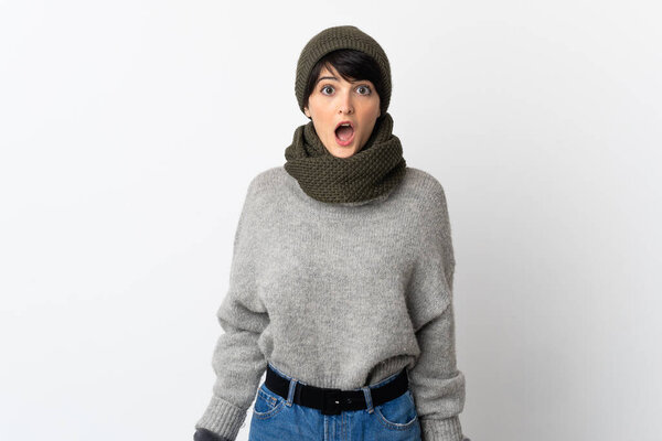 Young girl with winter hat with surprise facial expression