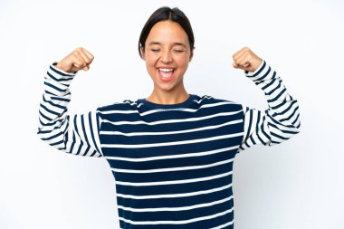 Young hispanic woman isolated on white background doing strong gesture