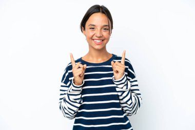 Young hispanic woman isolated on white background pointing up a great idea