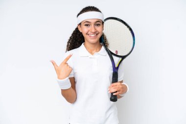 Young tennis player woman isolated on white background giving a thumbs up gesture