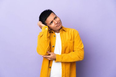 Young Ecuadorian man isolated on purple background thinking an idea