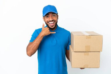 Delivery Ecuadorian man isolated on white background making phone gesture. Call me back sign