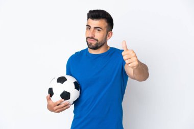 Yakışıklı genç futbolcu, izole olmuş duvarın üzerinden başparmaklarıyla geçti. Çünkü iyi bir şey oldu.