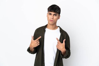 Young man over isolated white background pointing to oneself