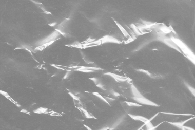 Plastik şeffaf siyah selofan arka plan. Doğal plastik doku yüzeyi.