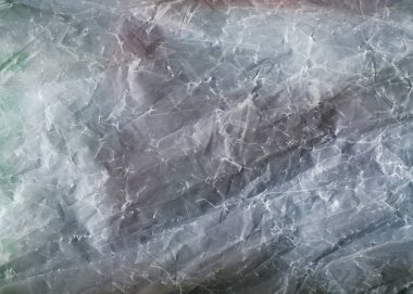 Buruşuk plastik yakın çekim dokusu. Selofan mavisi soyut arkaplan. 