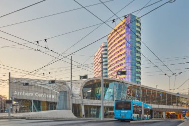 Arnhem, The Netherlands - December 12, 2022: View at the central railway station area  during rush hour with buses and commuters in Arnhem, The Netherlands