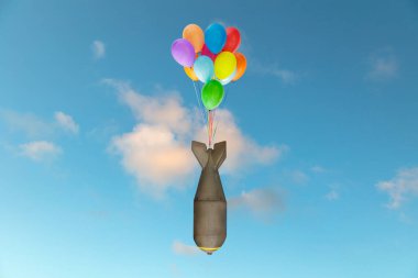 Düşen yeşil füze renkli balonlarda asılı.