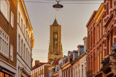 Shopping street in front of the Eusebius church in the Dutch city center of in Arnhem, The Netherlands clipart