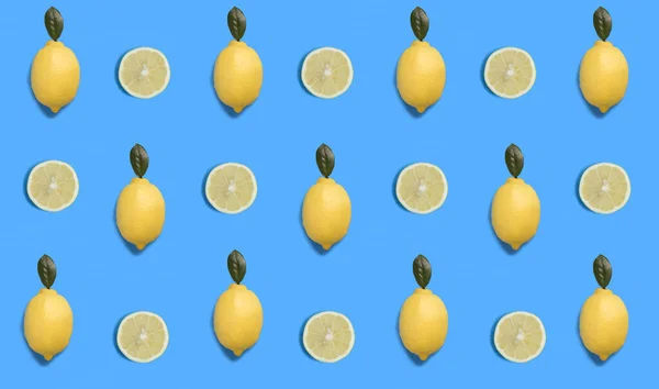 Lemon on the blue background. Flat lay. Pattern. Top view.