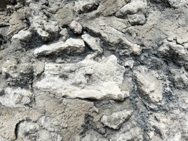 Büyük taşlı gri beton duvar. Yakın plan. Arkaplan.