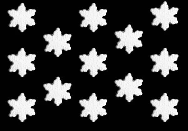 黒い背景の雪片の形をしたクリスマスジンジャーブレッド パターン フラットレイ — ストック写真