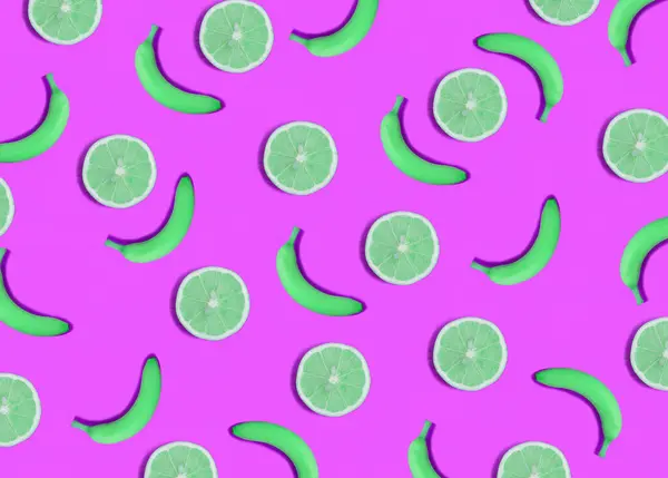 Green banana and lemon on the pink background. Flat lay. Pattern. Top view.