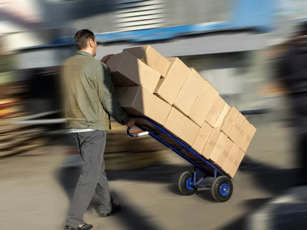 Stock image Blurred image of a man with a cart on the street 