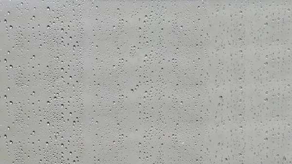 Regentropfen Bedeckten Die Glasoberfläche — Stockfoto
