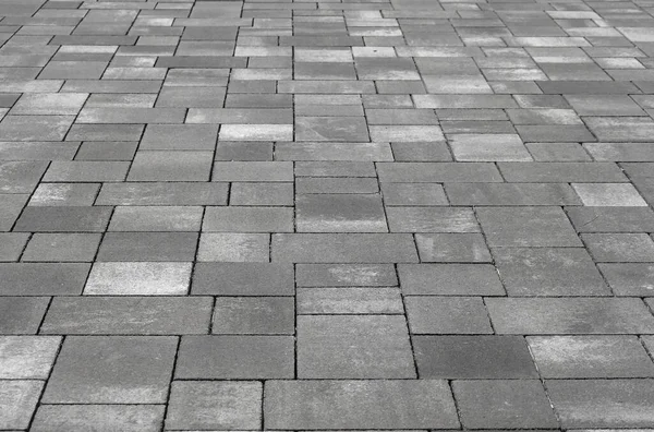 Perspektive Einer Straßenoberfläche Aus Flachen Steinen Unterschiedlicher Größe — Stockfoto