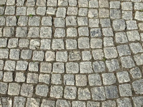 Kabaca Işlenmiş Taşlardan Yapılmış Bir Kaldırım Parçası — Stok fotoğraf