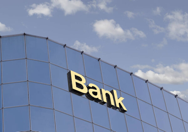 Volumetric inscription Bank on the glass wall of the building