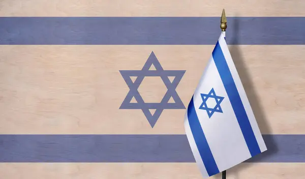 A small Israeli flag with a pale image of the Israeli flag in the background