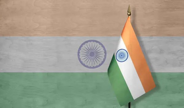 Small Indian flag with a pale image of the Indian flag in the background