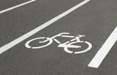 Street with a dedicated lane for cyclists clipart