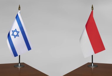 İsrail ve Endonezya 'nın bayrakları gri arka planda duruyor